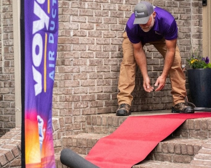 The signature Voyager red runner carpet rolled out from the front door through the home